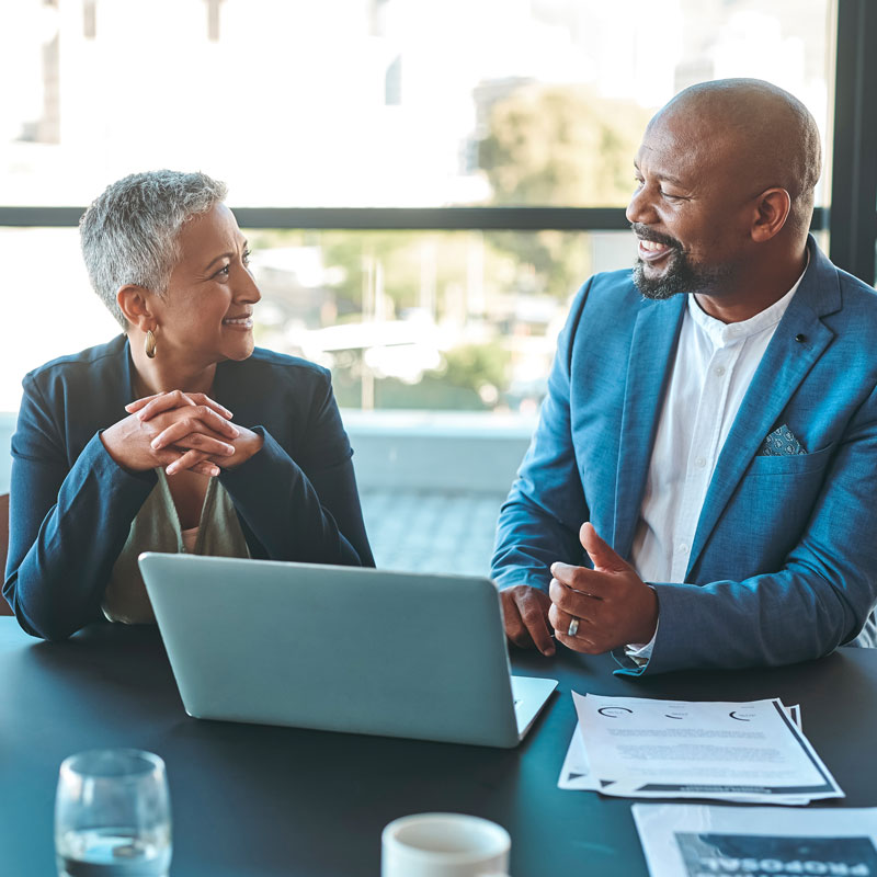 people looking at laptop